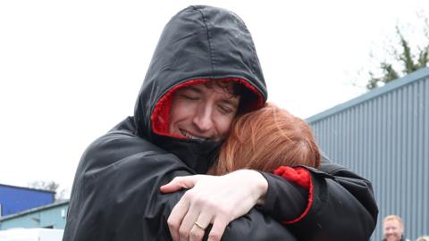 Greg James hugs friend and former Radio 1 DJ Alice Levine on Day 4 of his Longest Ride challenge