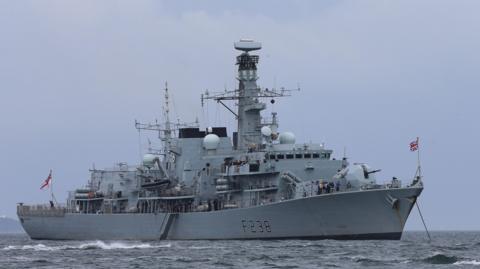 HMS Northumberland, a large grey navy ship, at sea, location unconfirmed, 2015. 