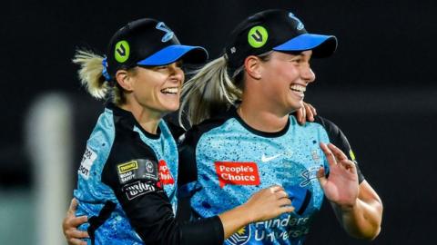 Katie Mack of the Adelaide Strikers celebrates after catching the wicket of Grace Harris of the Brisbane Heat with Maddie Penna of the Adelaide Strikers during the WBBL Final match between Adelaide Strikers and Brisbane Heat at Adelaide Oval