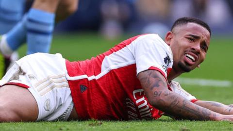 Arsenal striker Gabriel Jesus grimaces on the pitch