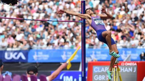 Joel Clarke-Khan in mid air as he does the high jump 