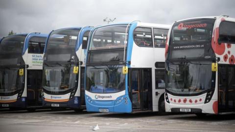 A row of empty Stagecoach buses at a depot