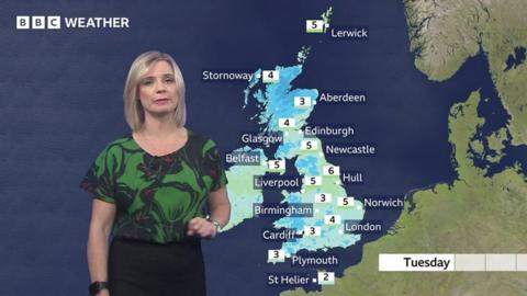 Sarah Keith-Lucas standing in front of a UK weather map