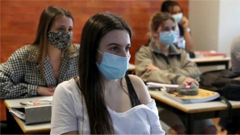 Students wearing face masks attend a class at the Padre Antonio Vieira high school in Lisbon, Portugal on April 19, 2021.