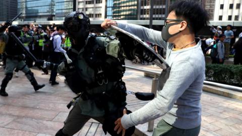 Riot police fighting with protester