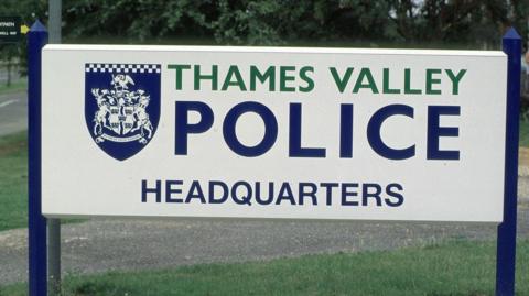 Sign says "Thames Valley Police Headquarters"