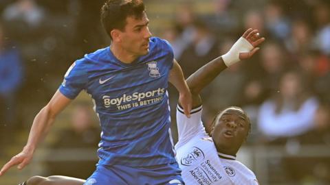 Maxime Colin of Birmingham City under pressure from Michael Obafemi of Swansea City