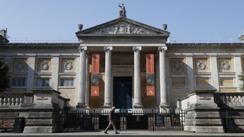 A man walks past the Ashmolean Museum in Oxford, southern central England, on April 24, 2020.