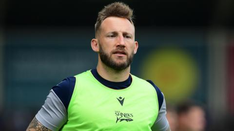 Byron McGuigan wearing Sale Sharks training gear