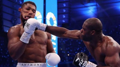 Anthony Joshua is punched hard by Daniel Dubois