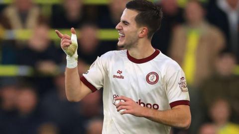 Anis Mehmeti points in celebration after scoring against Norwich