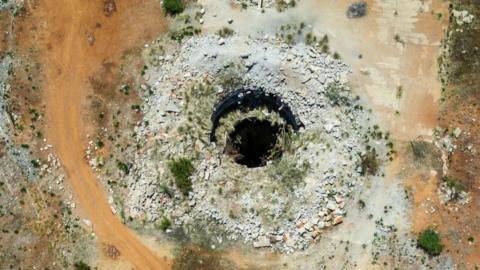 This aerial view shows an open mine shaft in Stilfontein.