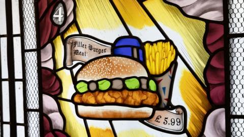 A chicken burger stained glass window