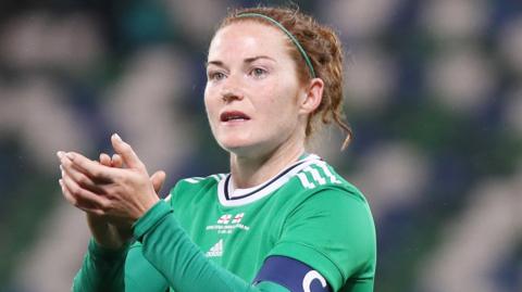 Marissa Callaghan applauds the fans after a Northern Ireland match