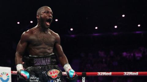 Ekow Essuman celebrates a win in the boxing ring