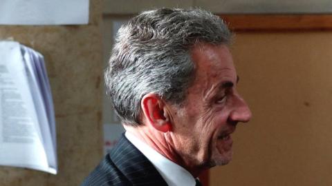 Nicolas Sarkozy, profile, leaving court