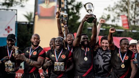 Uganda celebrate winning the Africa Men's Rugby Sevens title