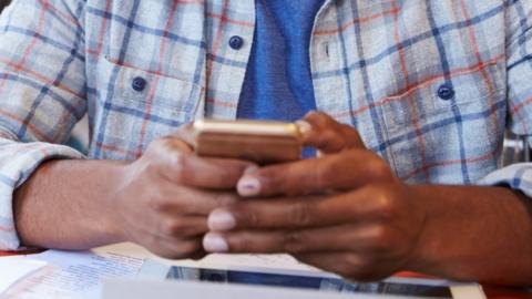 A man uses a mobile phone