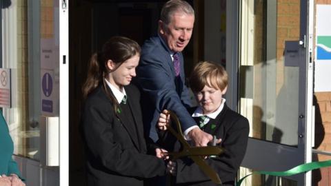 Chairman of the River Tees Multi-Academy Trust and pupils opening school