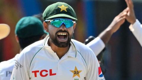 Babar Azam celebrates after taking the wicket of Sri Lanka's Dhananjaya de Silva during the fourth day of the second and final Test in Sri Lanka in July 2023