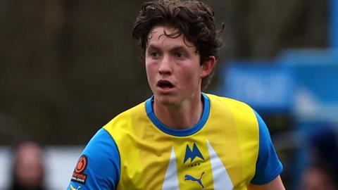 Ollie Tomlinson on the field for Torquay last season