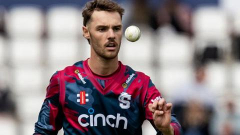 Northamptonshire spinner Freddie Heldreich throws himself a catch during a white-ball game.