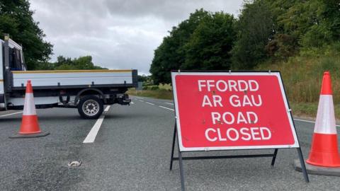 road closed sign on road