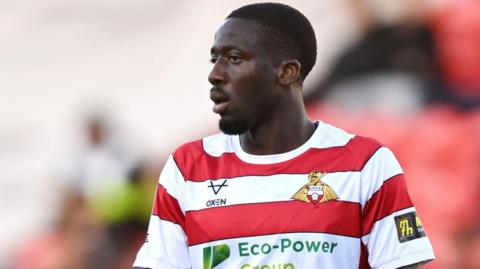 Joseph Olowu in action for Doncaster Rovers