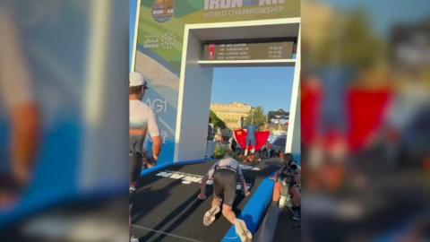 Neil Hunter crawls to the finish line in Nice