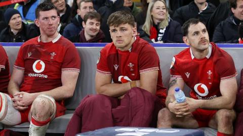 Wales players Adam Beard, Alex Mann and Tomos Williams look dejected after losing to England at Twickenham