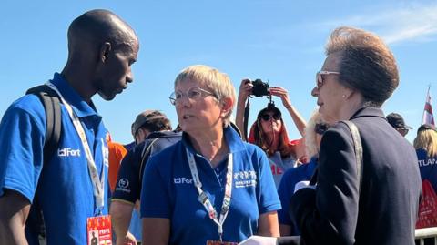 Benjamin Mutua and Julie Longden meeting Princess Anne at the Island Games opening ceremony.