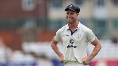 Luis Reece smiles while on the pitch for Derbyshire
