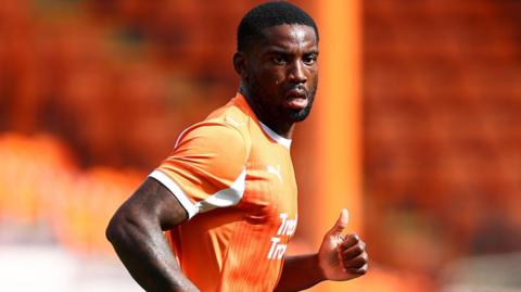 Kylian Kouassi in action for Blackpool