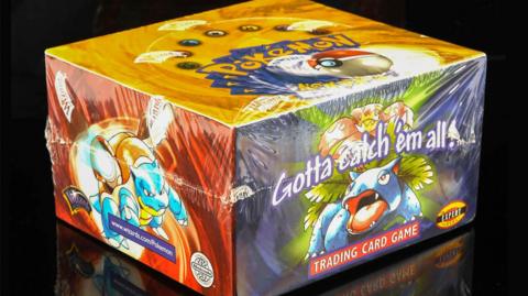 Sealed box of Pokémon cards with black background