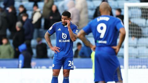 Dejected Leicester City players after their defeat by Swansea