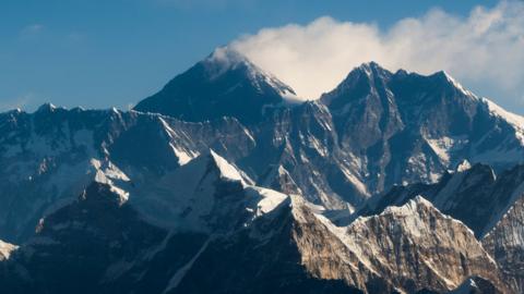 an aerial view of Mount Everest (C) and the Himalayan mountain range, some 140kms (87 miles) north-east of Kathmandu on February 7, 2020