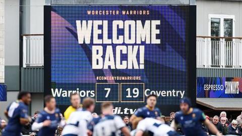 General view of the Worcester verses Coventry match with the digital scoreboard in the background showing the score and WELCOME BACK above it