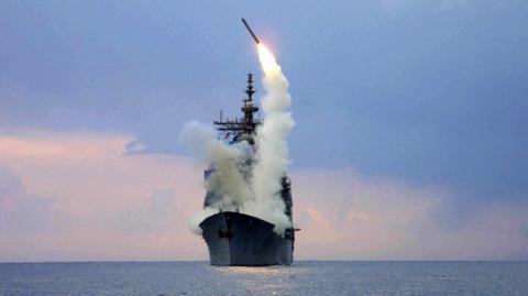 A Tomahawk Land Attack Missile is launched from a US missile cruiser