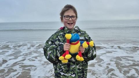 Child with teddy bear 