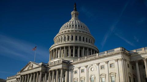 An exterior shot of the US Capitol building during daylight hours.