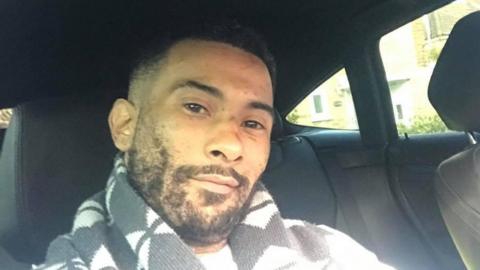 Leroy Mitchell - a man with a short beard and short hair. He is pictured in a selfie taken in a car.
