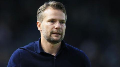 Plymouth Argyle head coach Tom Cleverley looks frustrated during the match against Leyton Orient