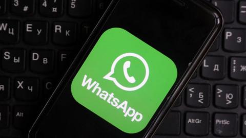 Pictured in this photo illustration is the WhatsApp application logo launched on a mobile phone