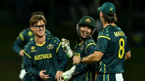 Adam Zampa celebrates wicket with Josh Inglis and Mitchell Marsh