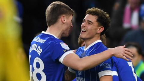 Alex Robertson (right) celebrates scoring for Cardiff with Dylan Lawlor