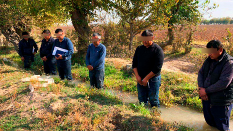 Six Uzbek men made to stand in irrigation ditch, October 2018
