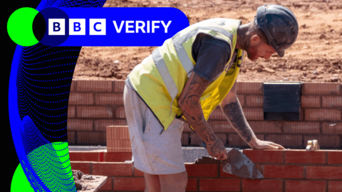 A bricklayer working on a housing site in the UK