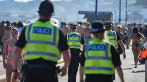 Photo of police officers patrolling Bournemouth beach