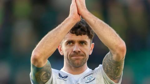 Robbie Brady applauds the Preston fans
