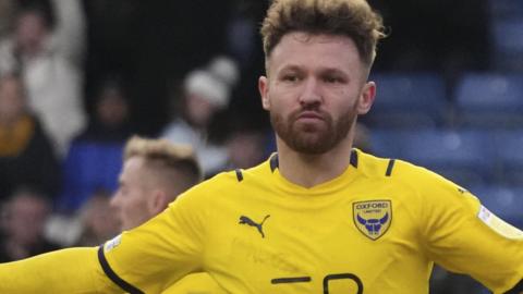 Matty Taylor celebrates a goal for Oxford